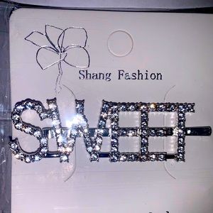 This is a silver hair clip that adds a little something to a hairstyle.